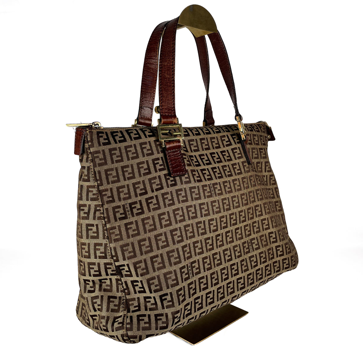 Side view of Fendi Zucchino canvas and leather handbag