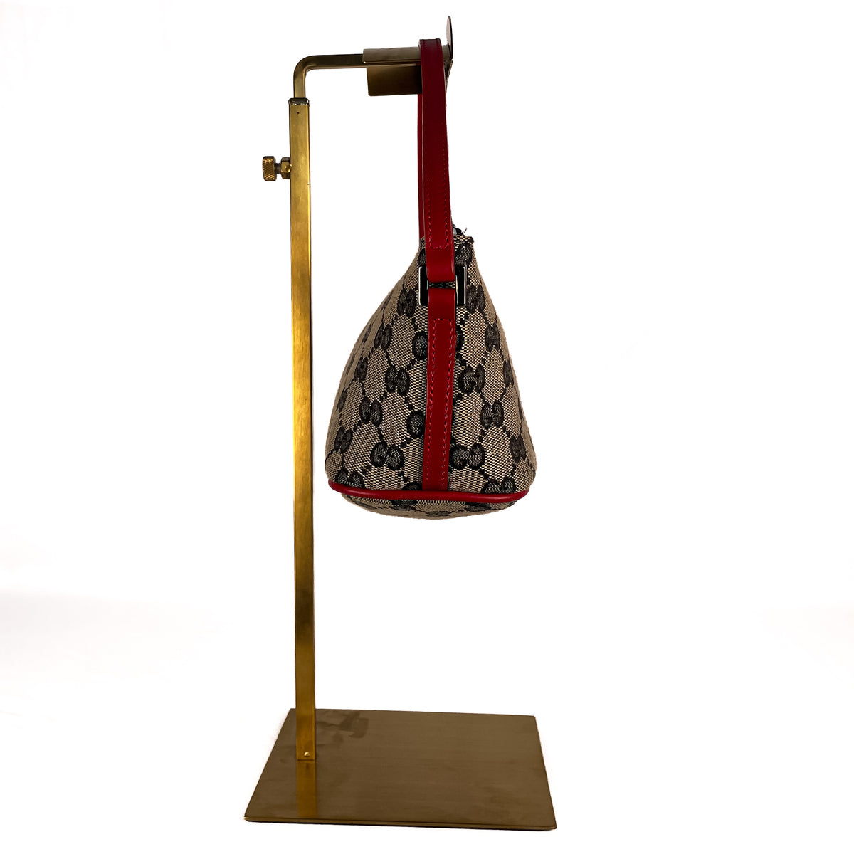 Side view of beige Gucci GG Canvas Boat shoulder bag