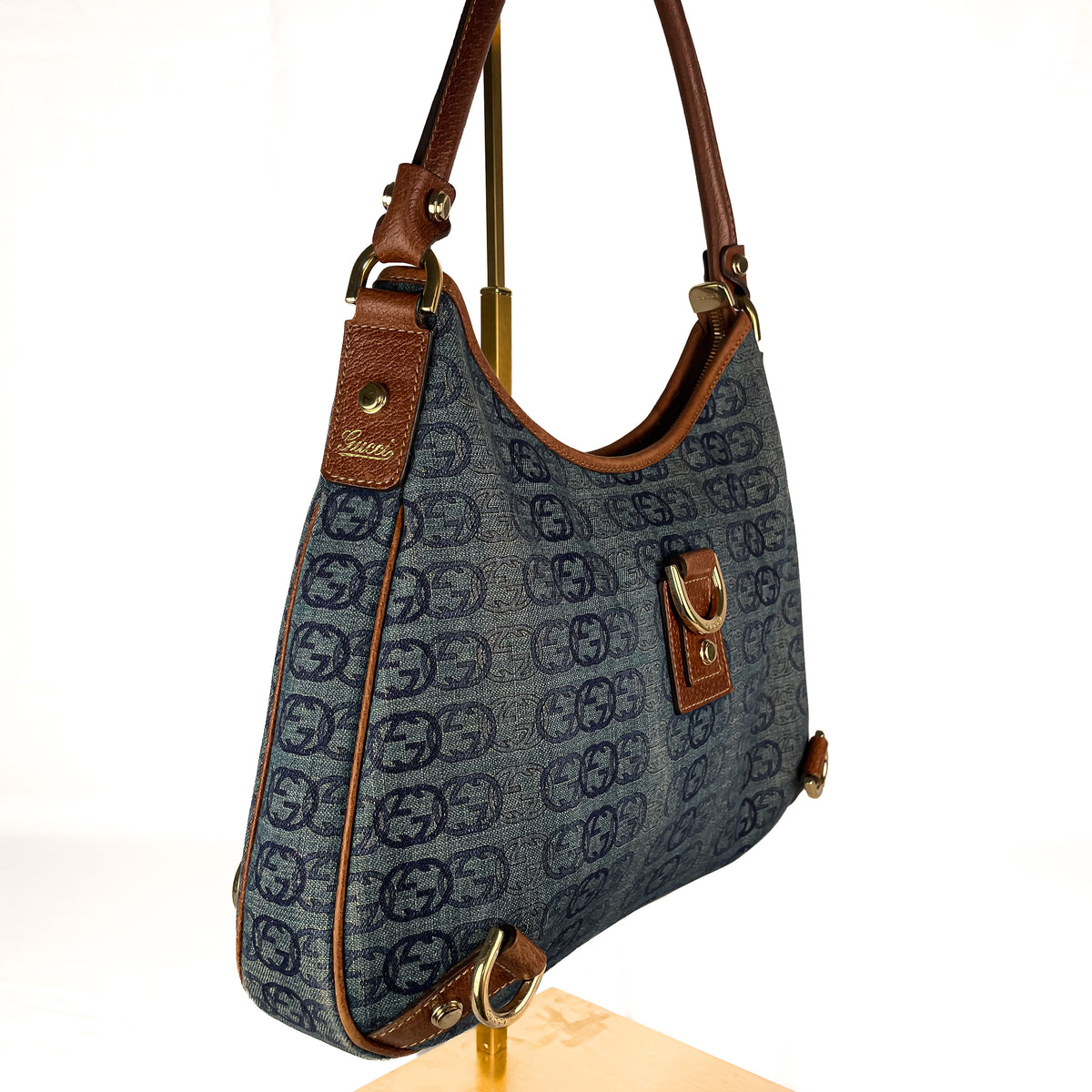 Gucci GG monogram denim with brown leather trim