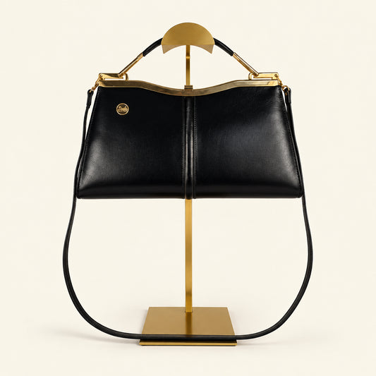 Vintage Céline Horse & Carriage navy leather handbag with gold-tone medallion